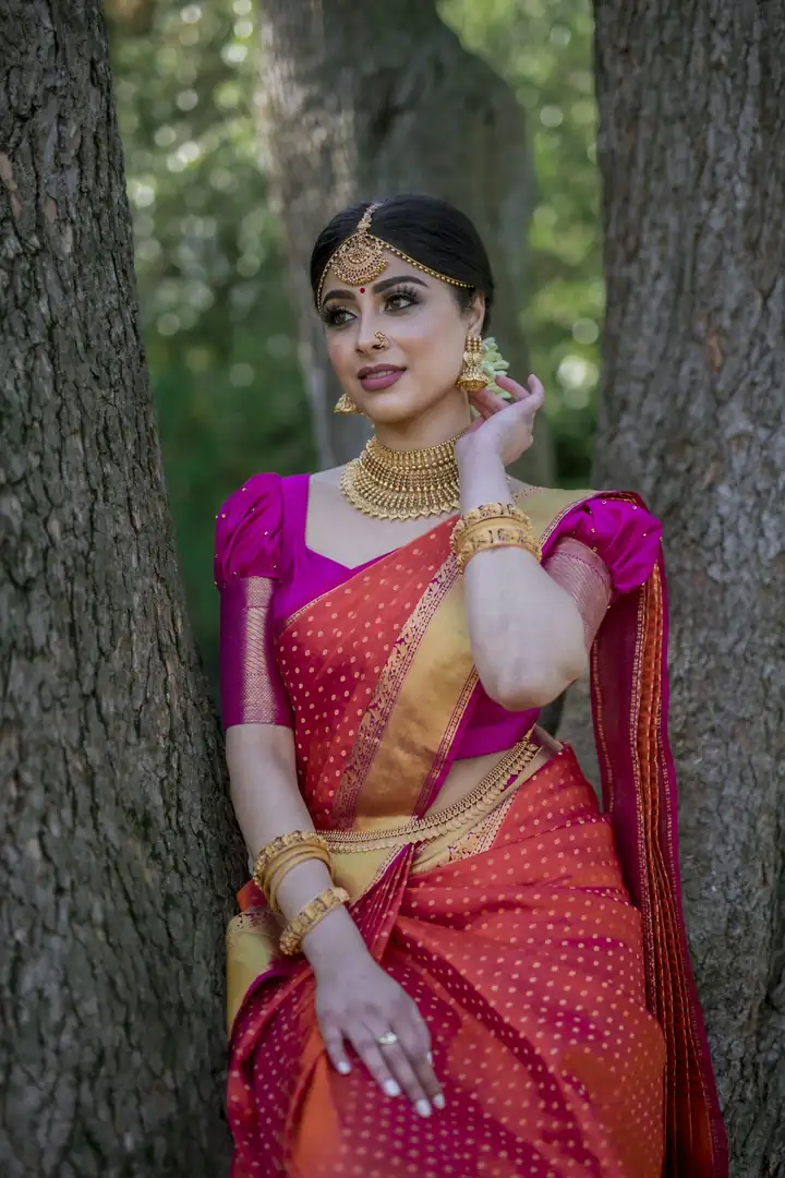 Bride in a pink and orange saree — @quince.event on Instagram