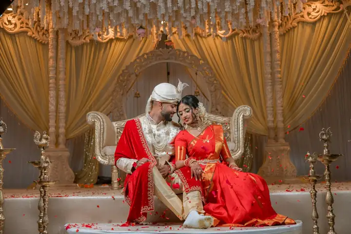 Newlyweds on their reception stage — @quince.event on Instagram