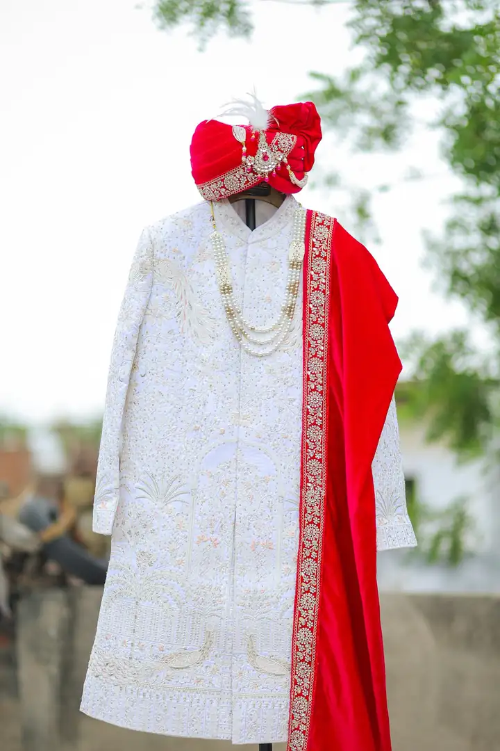Groom in a white sherwani — @quince.event on Instagram